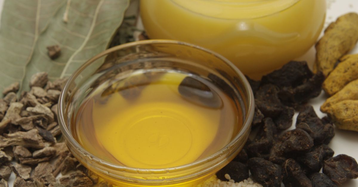 Composition of honey and natural ingredients like seeds and herbs in a vertical layout.